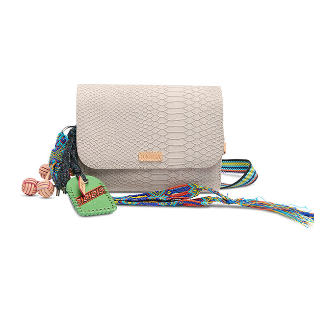Beige textured handbag with colorful strap and decorative elements on a white background