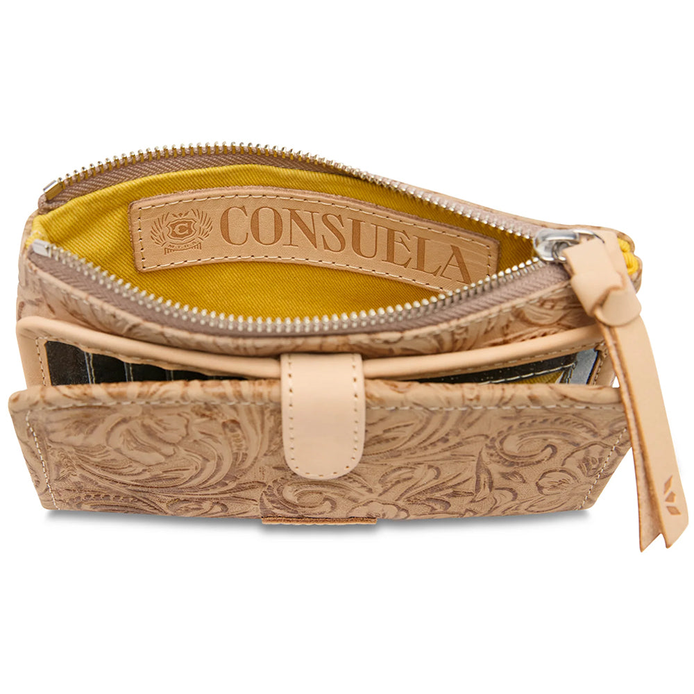 An open tan tooled leather pouch with a bright yellow interior lining and a tan leather brand label reading 'CONSUELA'.