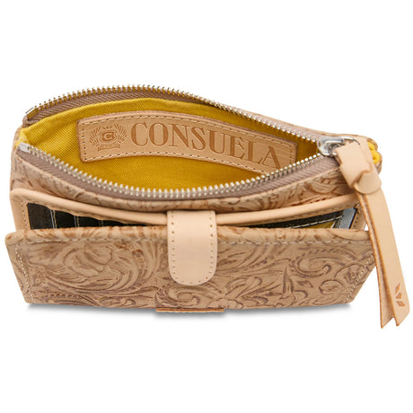 An open tan tooled leather pouch with a bright yellow interior lining and a tan leather brand label reading 'CONSUELA'.