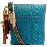 Blue textured handbag with colorful tassels on a white background