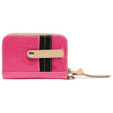 Pink wallet with black stripe and beige strap on a white background