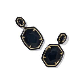 Black and gold earrings on a white background