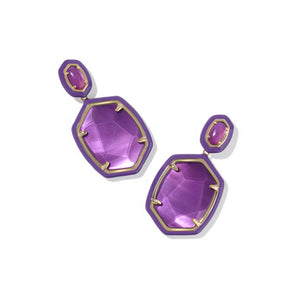 Purple earrings with gold accents on a white background
