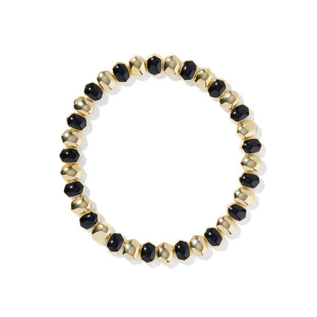 Bracelet with black and gold beads on a white background