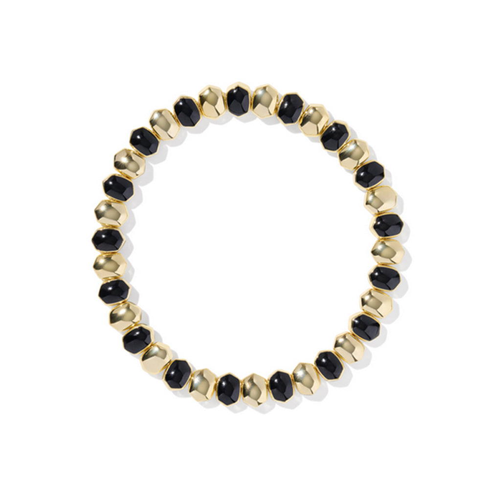 Bracelet with black and gold beads on a white background