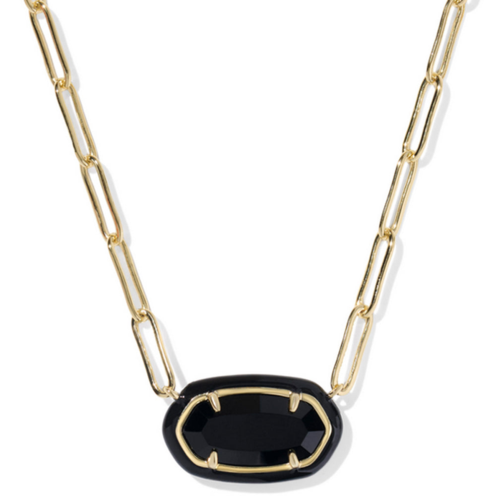 Gold chain necklace with a black pendant on a white background