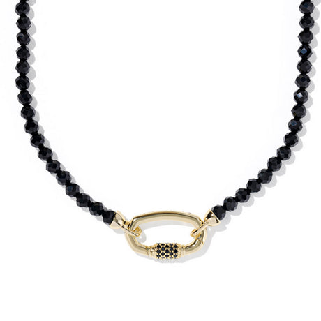 Black beaded necklace with a gold clasp on a white background