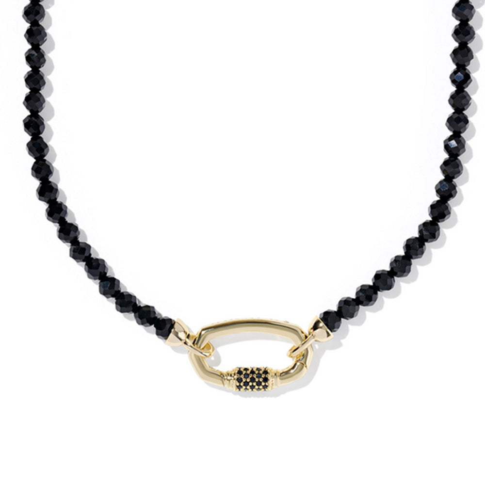 Black beaded necklace with a gold clasp on a white background