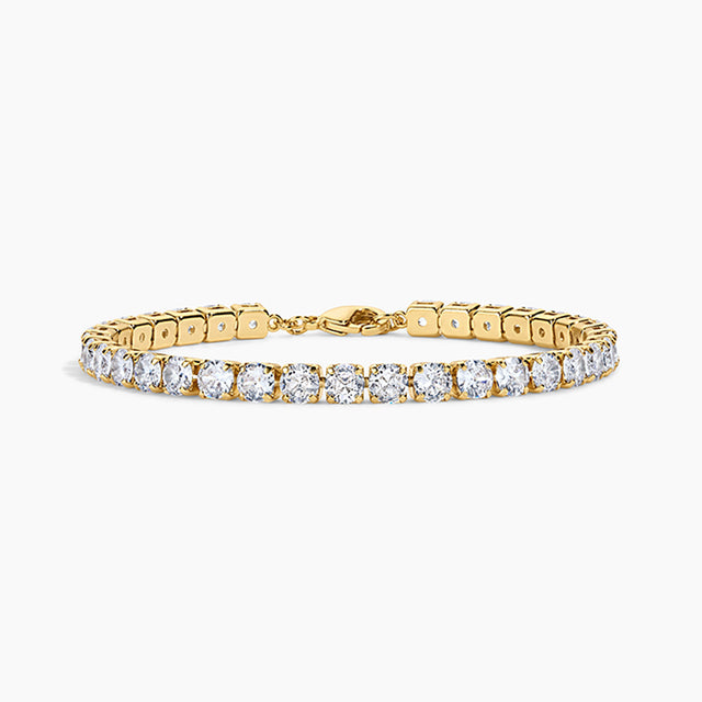 A yellow gold tennis bracelet featuring a continuous row of round-cut clear gemstones, displayed on a clean white background.