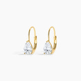 A pair of gold leverback earrings with pear-cut clear gemstones, displayed on a clean white background.