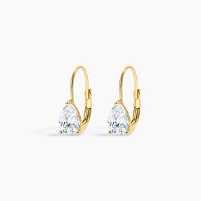 A pair of gold leverback earrings with pear-cut clear gemstones, displayed on a clean white background.