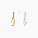 A pair of gold drop earrings with marquise-cut clear gemstones, shown against a plain white background.