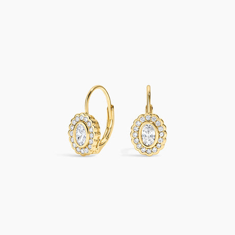 A pair of gold leverback earrings with oval halo settings, featuring clear marquise-cut center stones surrounded by small round stones, shown on a light gray background.