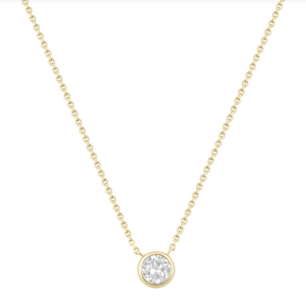 Gold necklace with a round diamond pendant on a white background