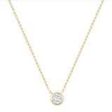 Gold necklace with a round diamond pendant on a white background