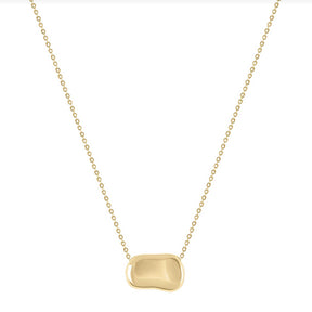Gold necklace with a unique pendant on a white background