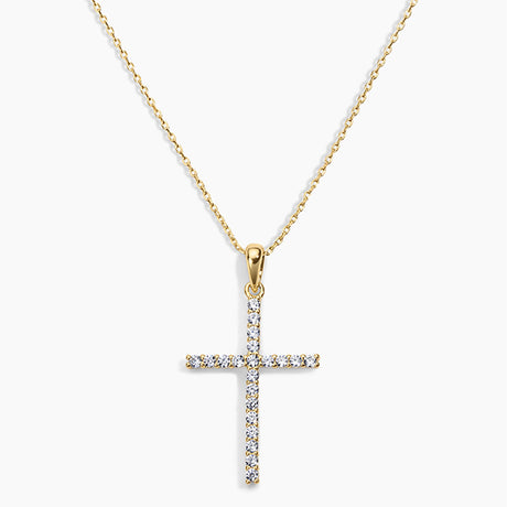 Gold cross pendant necklace on a white background
