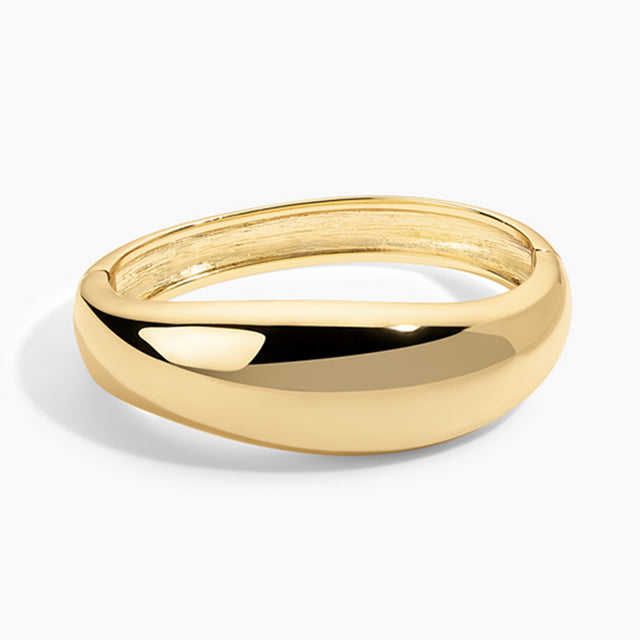 Gold bangle on a white background