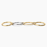 Three interlocking rings in gold, silver, and rose gold on a white background