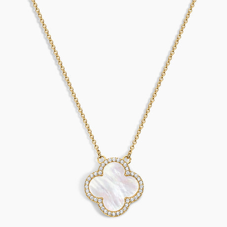 Gold necklace with a clover-shaped pendant on a white background
