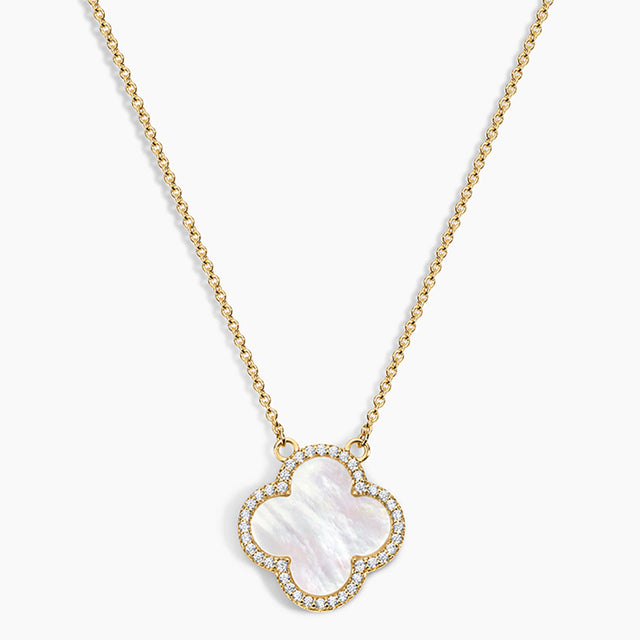 Gold necklace with a clover-shaped pendant on a white background
