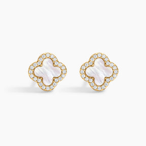 Pair of gold earrings with white center and clear stones on a white background