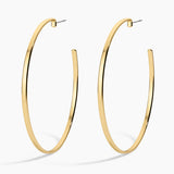 Gold hoop earrings on a white background