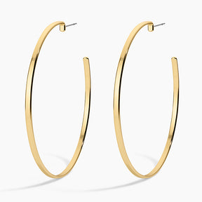 Gold hoop earrings on a white background