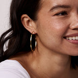woman wearing a gold hoop earring