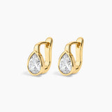 Gold drop earrings on a white background