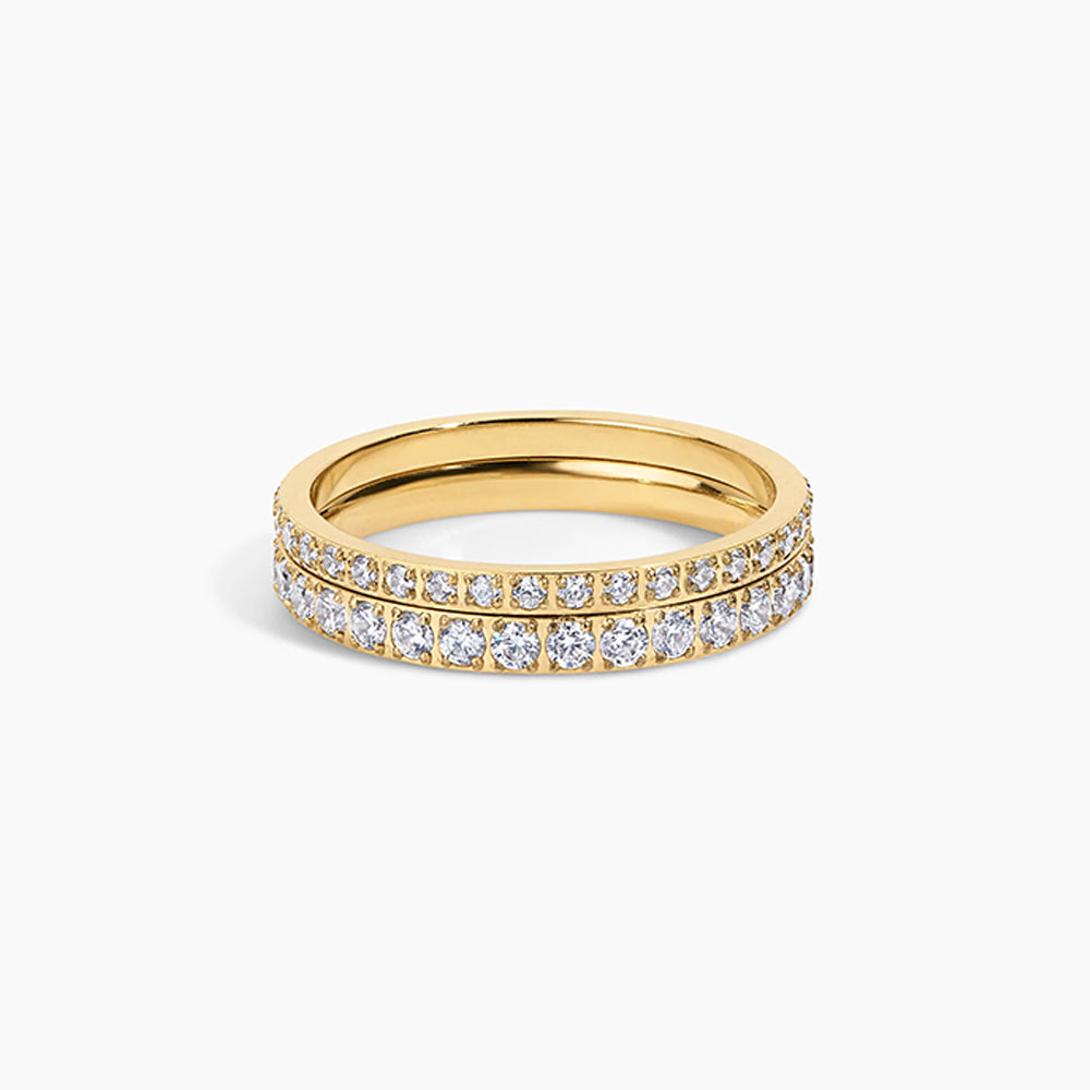 A yellow gold eternity ring featuring two rows of pavé-set round diamonds on a clean white background.
