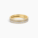 A yellow gold eternity ring featuring two rows of pavé-set round diamonds on a clean white background.