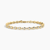 gold bracelet on white background