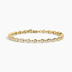 gold bracelet on white background