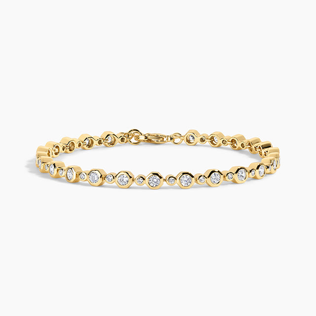 gold bracelet on white background