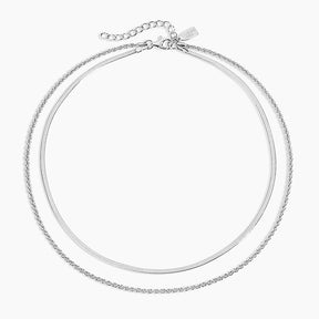 Double chain silver necklace on a white background