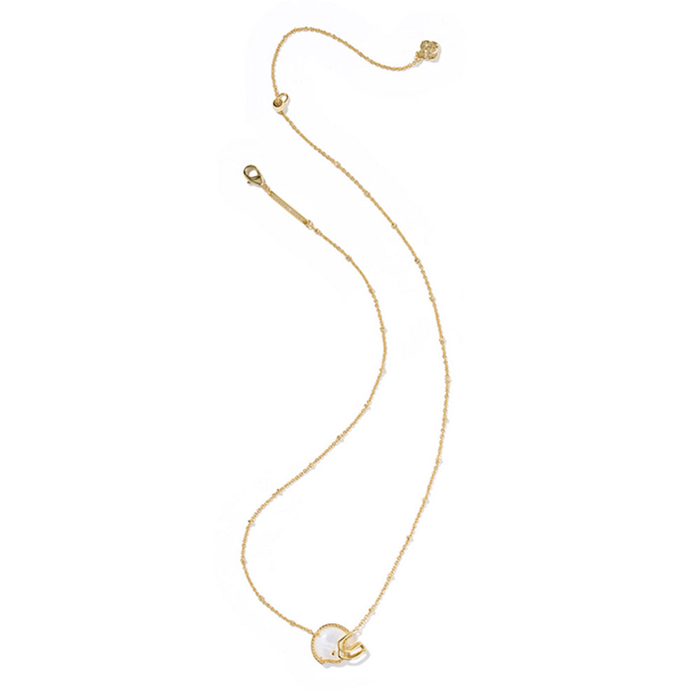 Gold necklace with a small pendant on a white background