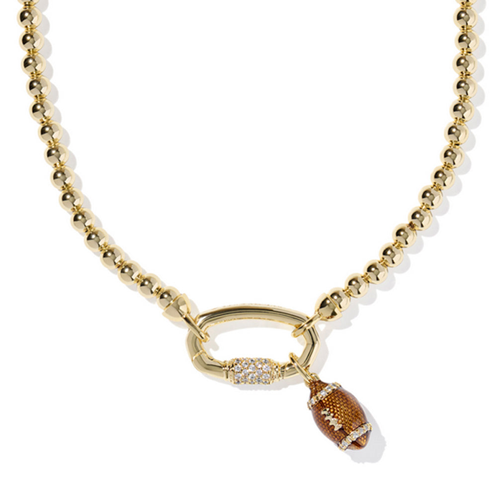 Gold necklace with a small brown pendant on a white background