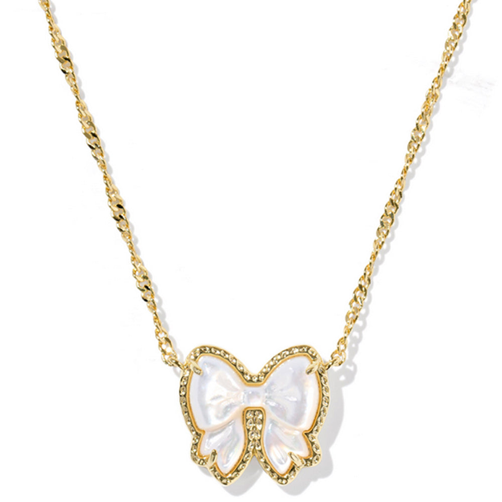 Bow-shaped pendant necklace with gold chain on a white background