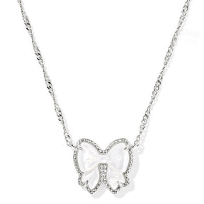 Bow-shaped pendant necklace on a white background
