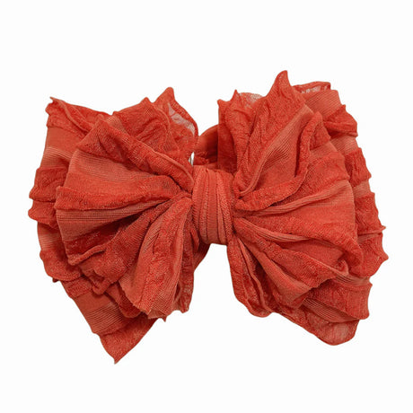 Large orange bow on a white background