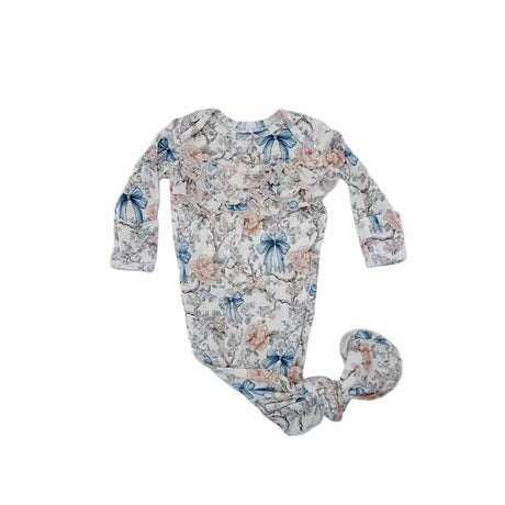 Floral-patterned baby onesie on a white background