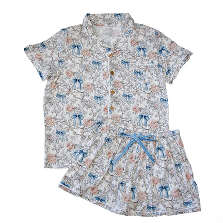 Floral and bow-patterned pajama set on a white background