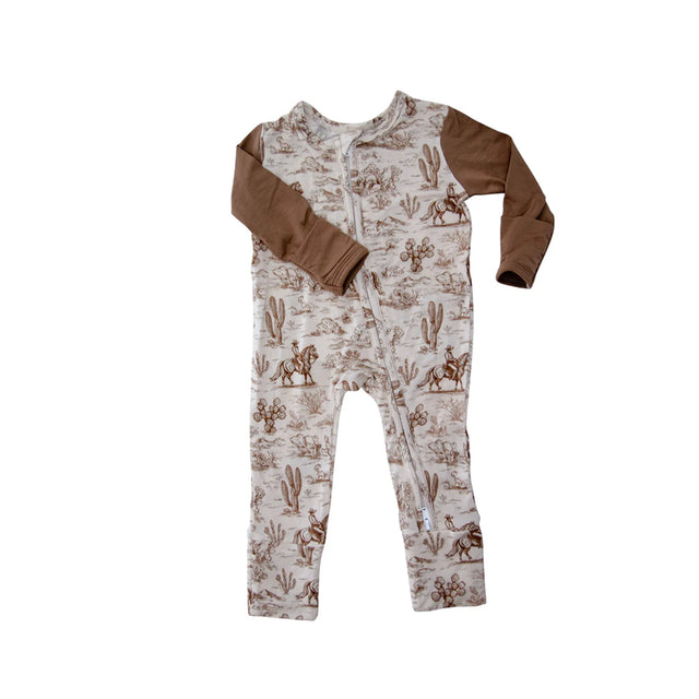 Baby onesie with cowboy pattern and brown sleeves on a white background