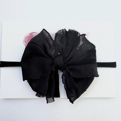 Black bow headband on a white background