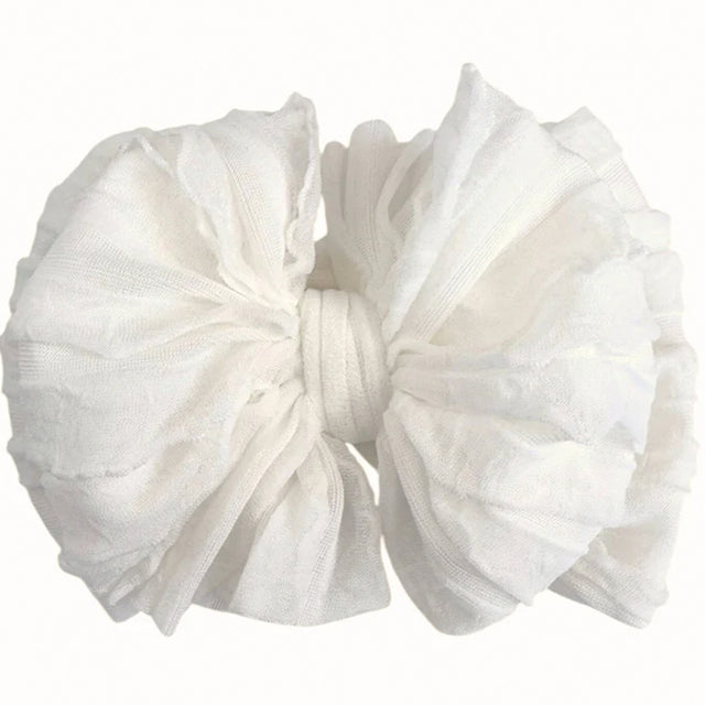 White fabric bow on a white background