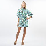 Woman wearing a floral dress on a white background