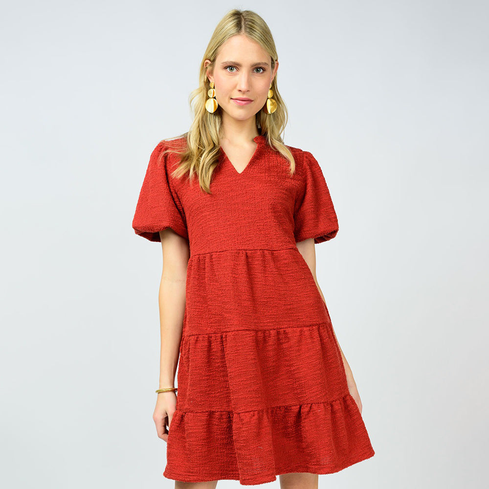 Woman wearing a red dress on a white background