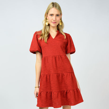 Woman wearing a red dress on a white background