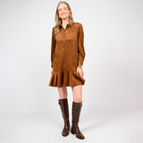 Woman wearing a brown dress and boots on a white background